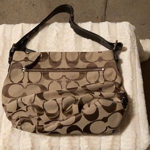 A medium size coach bag, tan and brown